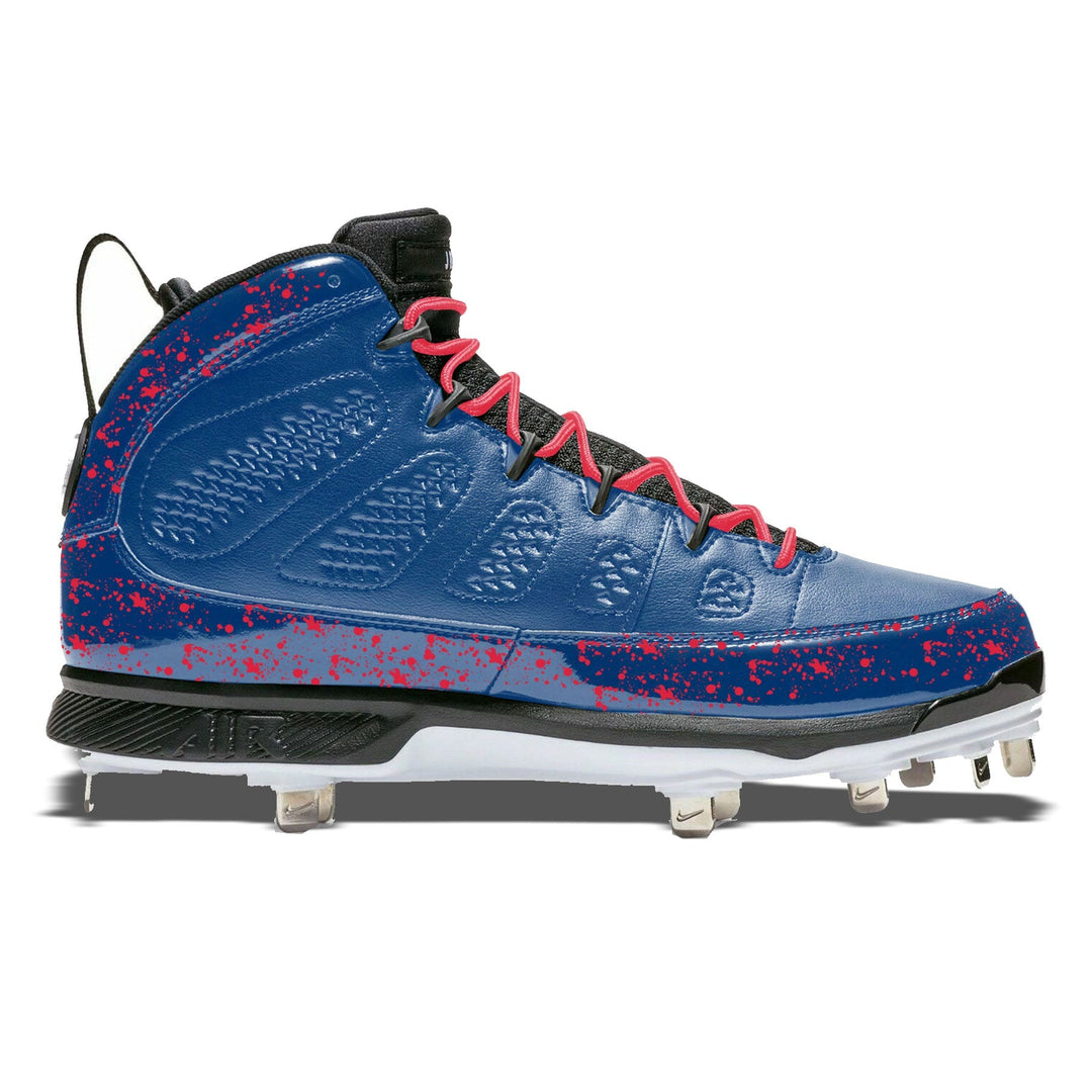 Jordan 9 Retro baseball cleats in navy blue with red splatter design and red laces, hand-painted Midnight Splatter custom cleats
