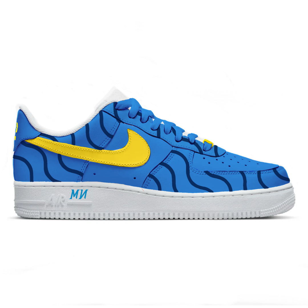 Blue sneaker with yellow swoosh logo on a white background