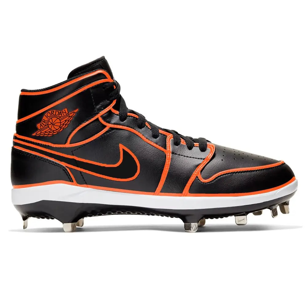 Black and orange cleated shoe with Nike logo on a white background