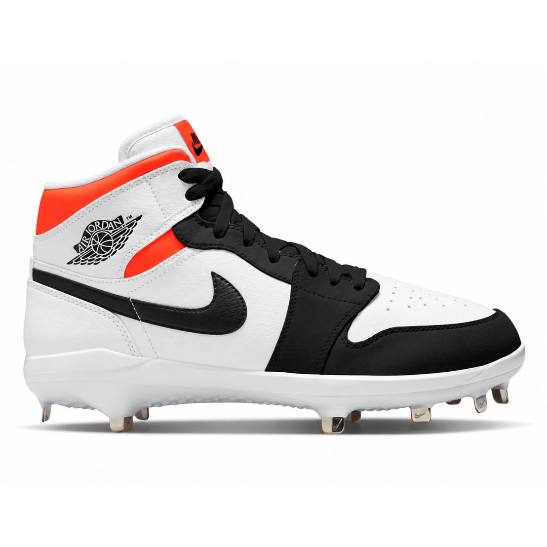 A Nike Air Jordan 1 mid baseball cleat in white, black, and neon orange, featuring a white leather upper with black overlays, a black Swoosh, and a black Jumpman logo on the side. It has a white rubber sole with metal studs for baseball gameplay.