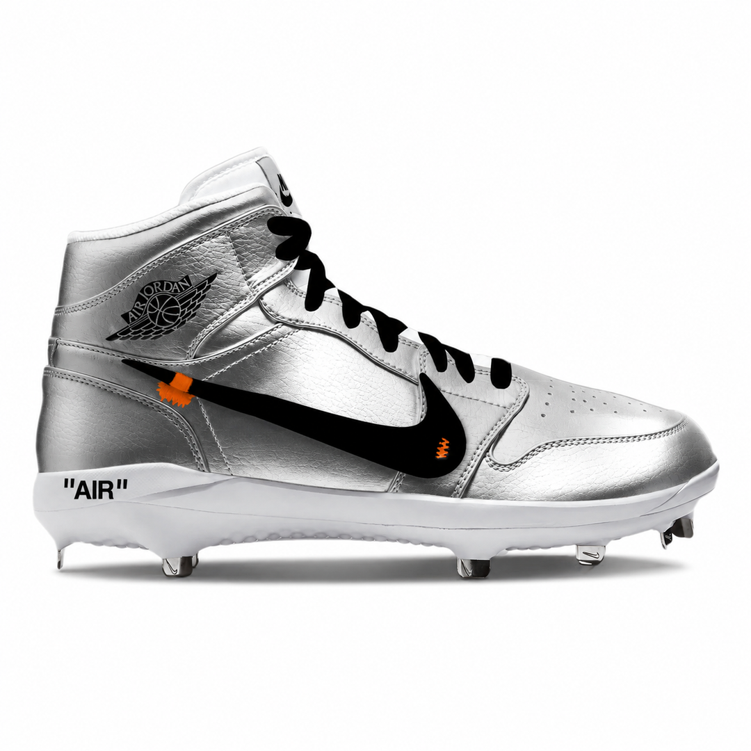 A metallic silver high-top Nike baseball cleat with black laces, a black Swoosh, and small orange flame accents, shown from the side on a white background.