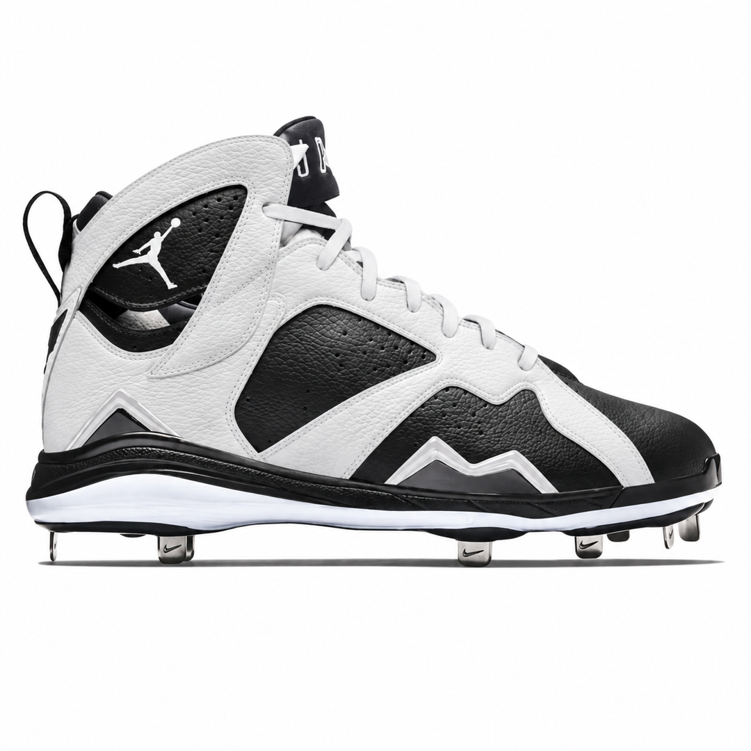 A high-top baseball cleat by Jordan, featuring a white and black color-blocked design with textured leather panels, white laces, and metal cleats on the sole, shown against a plain white background.