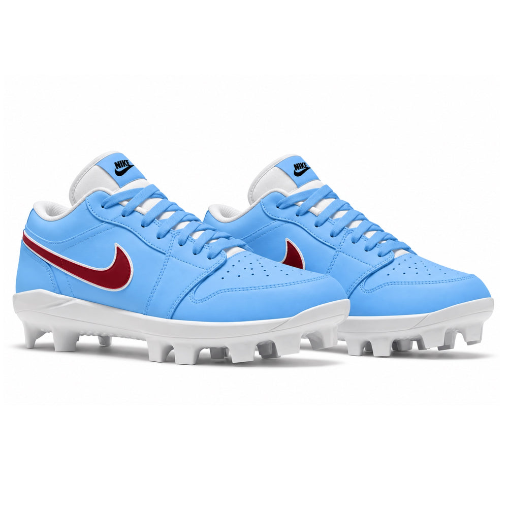 A pair of Nike baseball cleats in light blue with a red Swoosh and white soles, shown on a clean white background.
