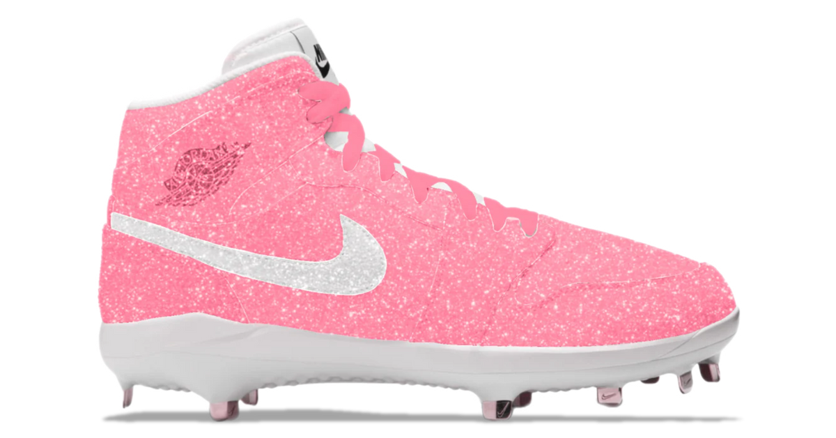 Pink cleated shoe with white Nike logo on a white background