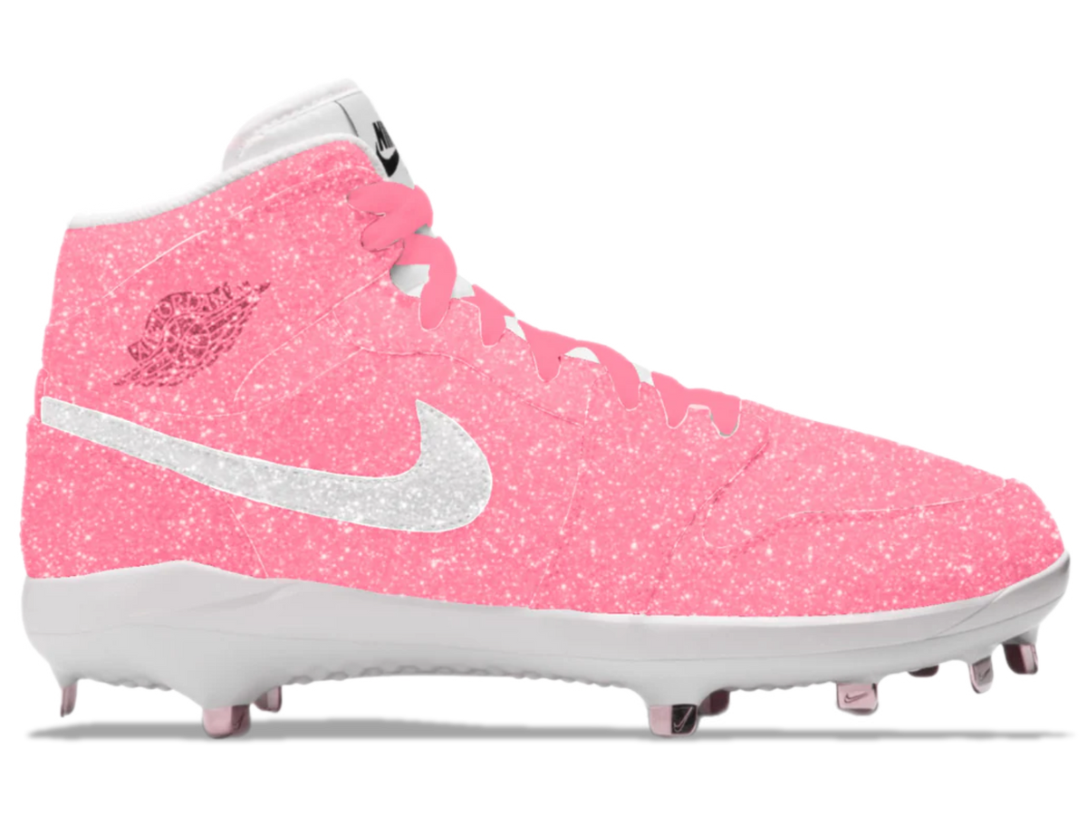 Pink cleated shoe with white Nike logo on a white background