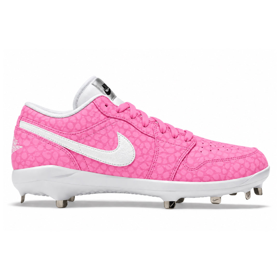 A pink and white Jordan baseball cleat with a textured patterned upper, white Swoosh, and metal studs on a white background.