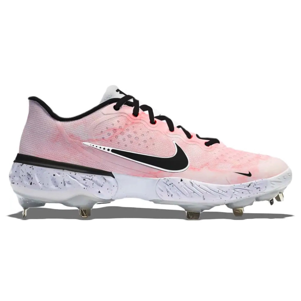 Pink and black cleated shoe with Nike logo on a white background