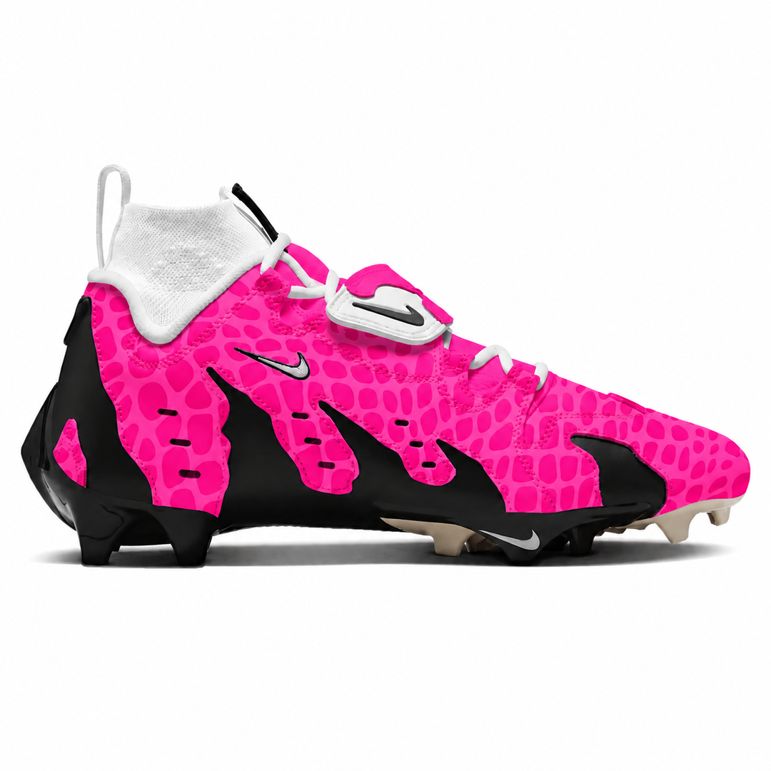 A Nike football cleat in vibrant pink and black with a textured pattern, featuring a white collar and white laces, shown from a side profile on a white background.