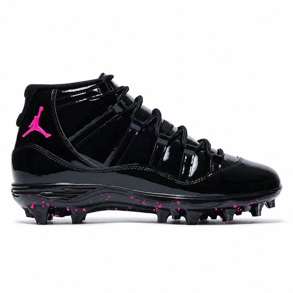 Pink Voltage Jordan 11 Retro TD football cleats featuring a glossy black patent leather upper, black ballistic mesh side panels, hot pink embroidered Jumpman logo on the ankle, black lace-up closure, and a black midsole with hot pink speckled molded traction outsole by Stadium Custom Kicks.