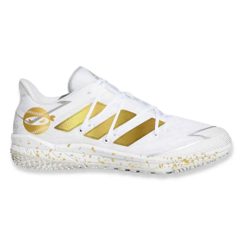 White and gold baseball cleat from Pitching Ninja Adidas Afterburner Turf Shoes