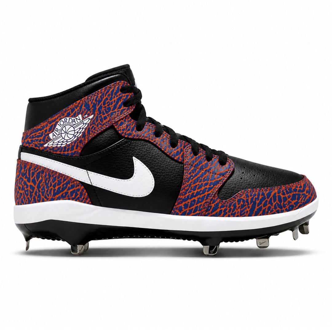 Black, orange and royal blue cleated shoe with a white Nike logo on a white background