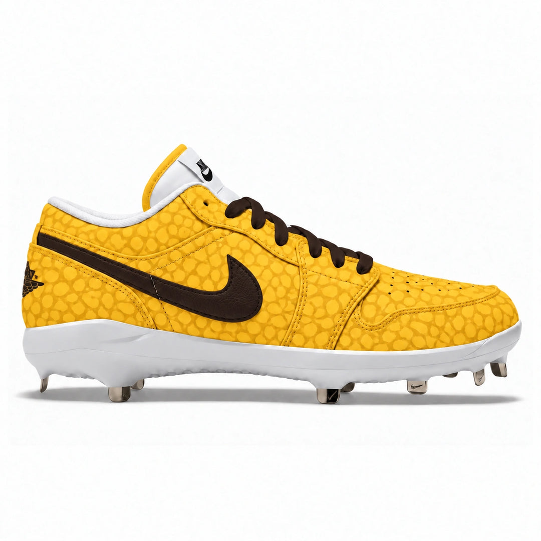 A Nike baseball cleat in a vibrant golden yellow with a textured pattern, featuring a prominent brown Swoosh, brown laces, and a white midsole and collar.