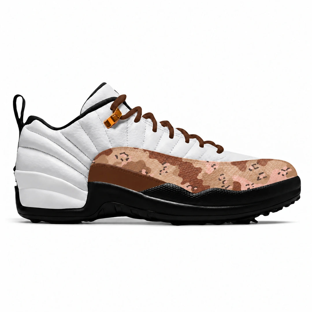 A low-top golf sneaker shown in a side profile on a white background. The shoe features a white leather upper, brown laces, a black sole, and a distinctive toe box panel with a pink, brown, and beige digital camouflage pattern.
