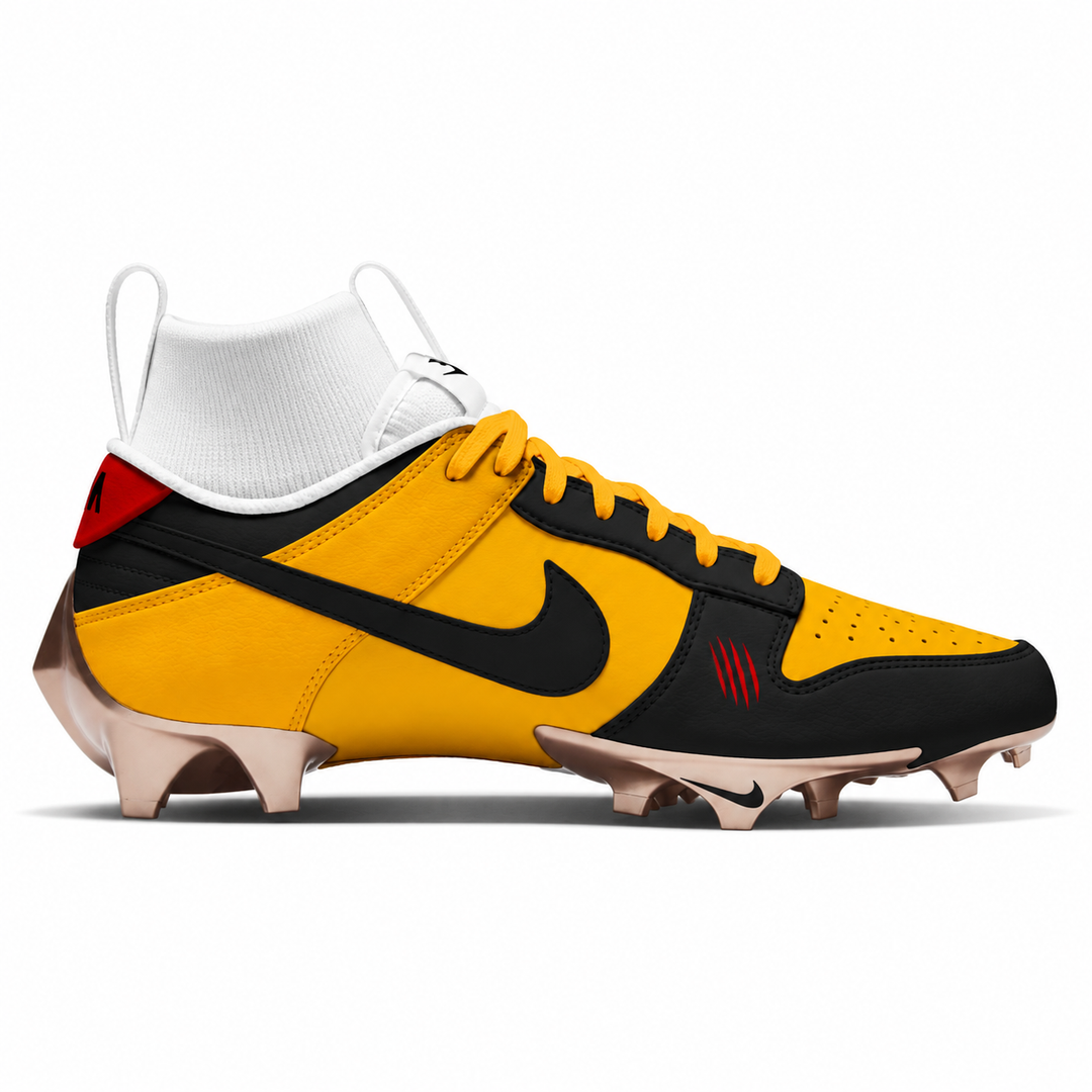 Yellow and black Nike football cleat featuring a matte black Swoosh, red scratch accents, yellow laces, white tongue and sockliner, and metallic bronze sole.