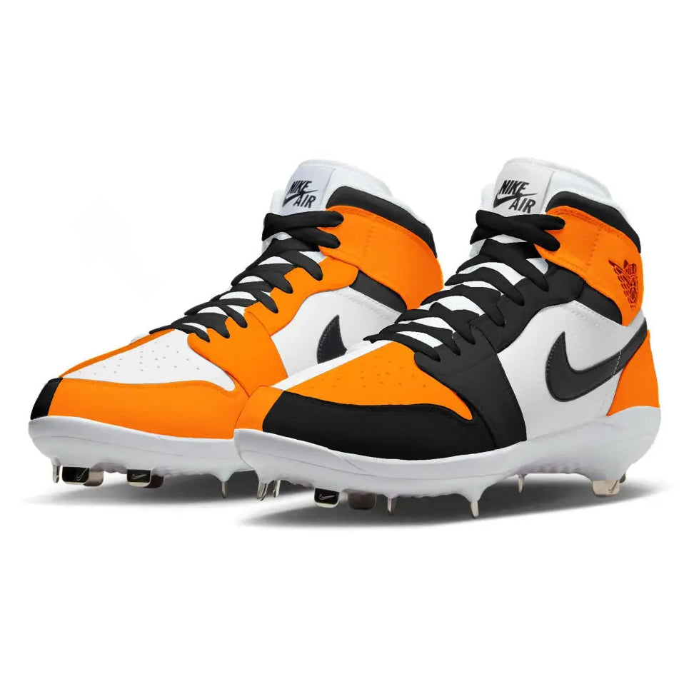 Orange, black, and white cleats with Nike logo on a white background