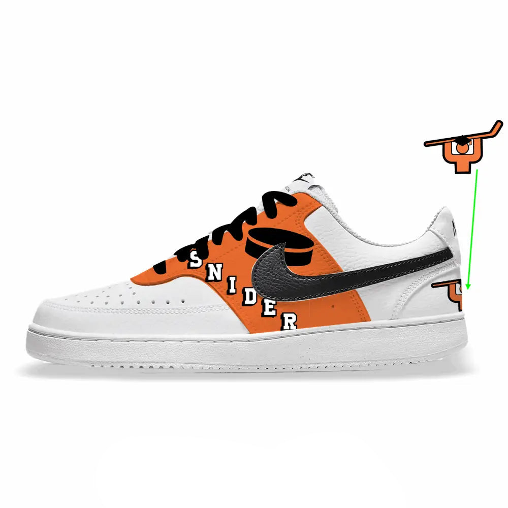 White sneaker with orange and black design on a white background