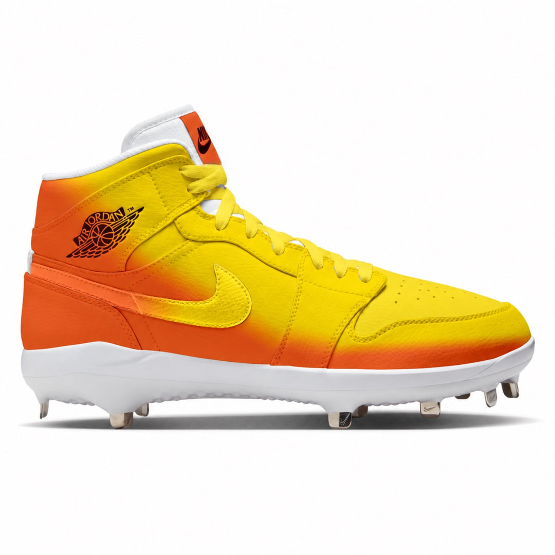 A Jordan baseball cleat featuring a vibrant yellow and orange gradient upper with a white sole and metal cleats.