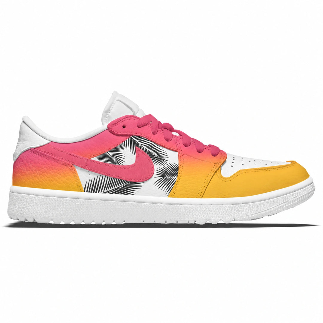 A low-top Nike golf sneaker shown in a side profile on a white background. The shoe features a white leather base with a vibrant pink-to-yellow gradient overlay, a pink Nike Swoosh, and a black palm leaf pattern on the side panel.