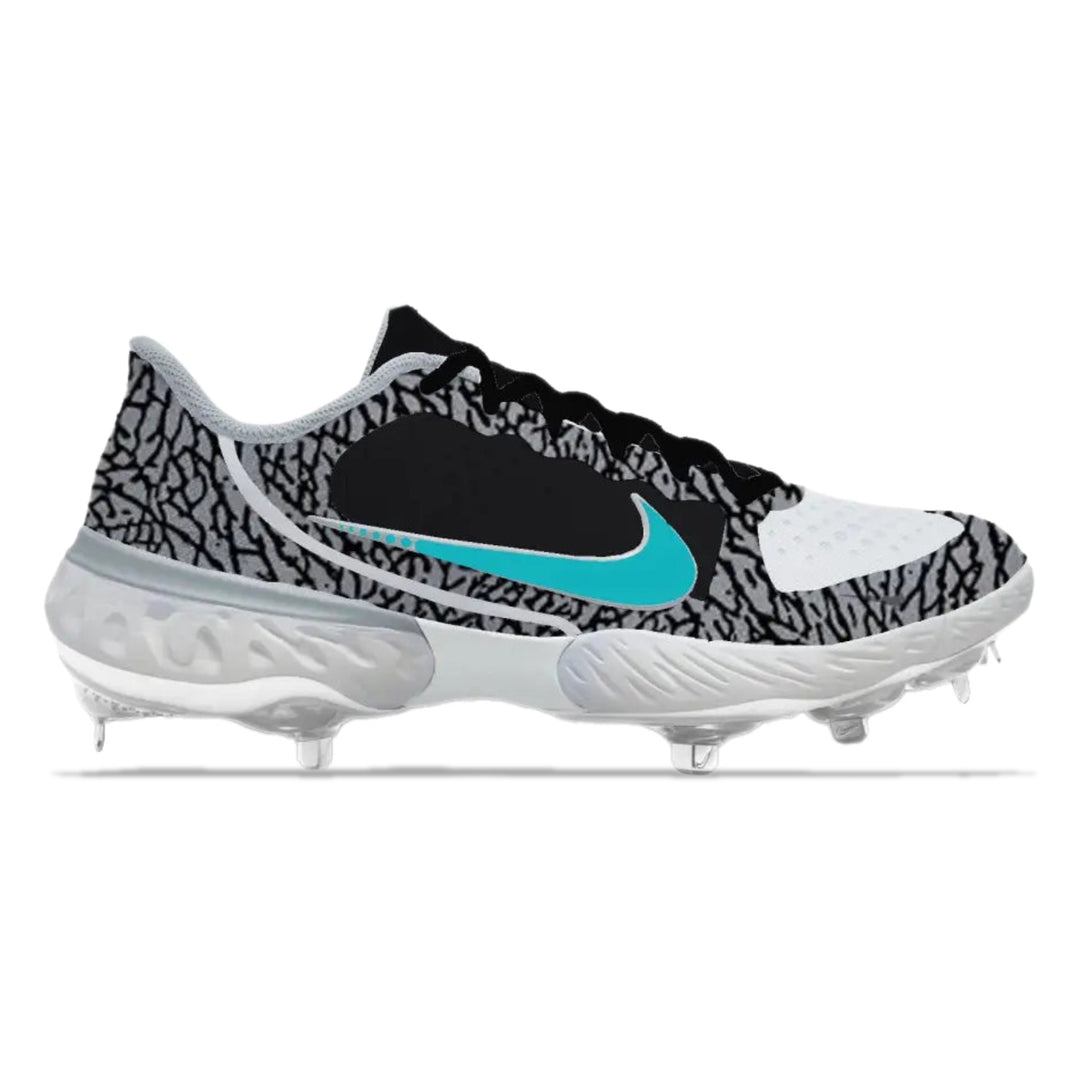 Baseball cleat with black, white, and gray pattern on a white background