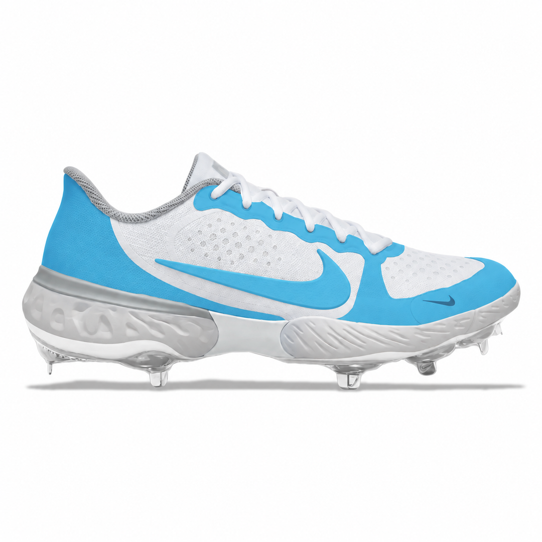 White and Carolina blue Nike baseball cleat featuring a smooth Carolina blue Swoosh, white laces, and silver detailing on a white background.