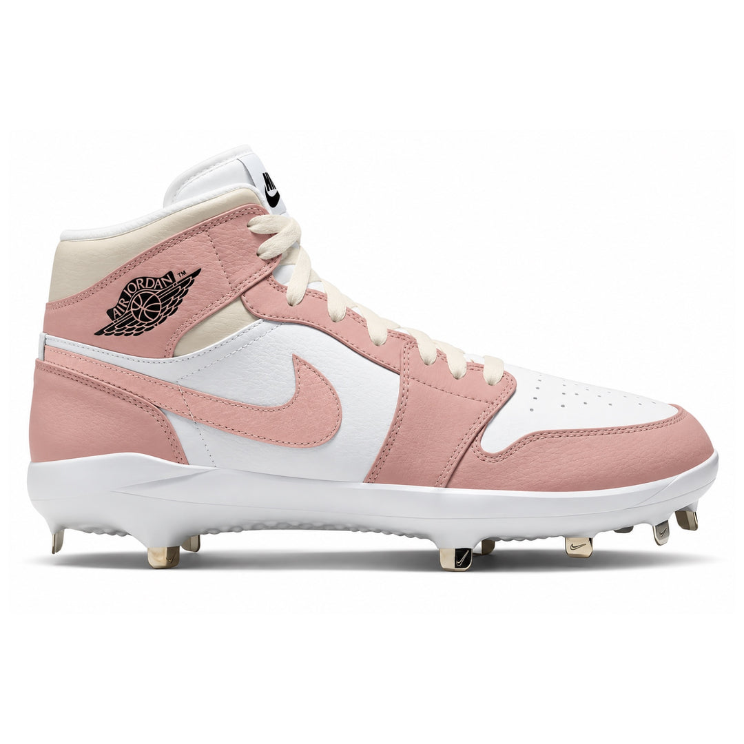 A high-top Nike baseball cleat in a dusty pink and white colorway, featuring a black Jordan Wings logo on the ankle collar and white cleats on the sole, shown against a plain white background.