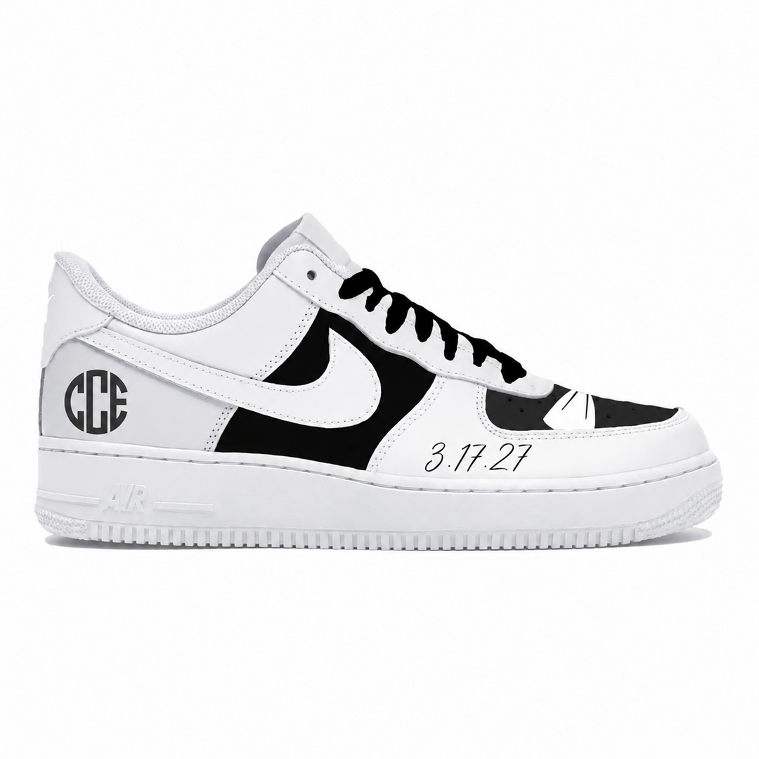 A white and black Nike Air Force 1 sneaker with custom monogram lettering 'GCE' on the heel, a white Nike Swoosh, black laces, and the date '3.17.