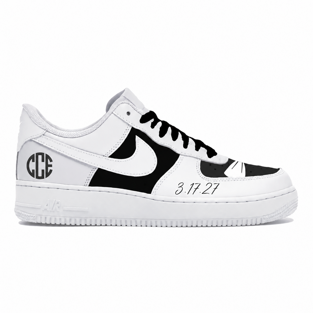 A white and black Nike Air Force 1 sneaker with custom monogram lettering 'GCE' on the heel, a white Nike Swoosh, black laces, and the date '3.17.