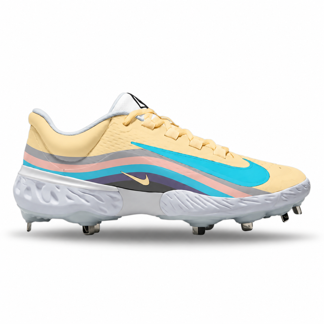A Nike baseball cleat featuring a pastel yellow upper, a white sole with metal studs, and a colorful side stripe design in turquoise, pink, gray, and a small gold Nike swoosh.