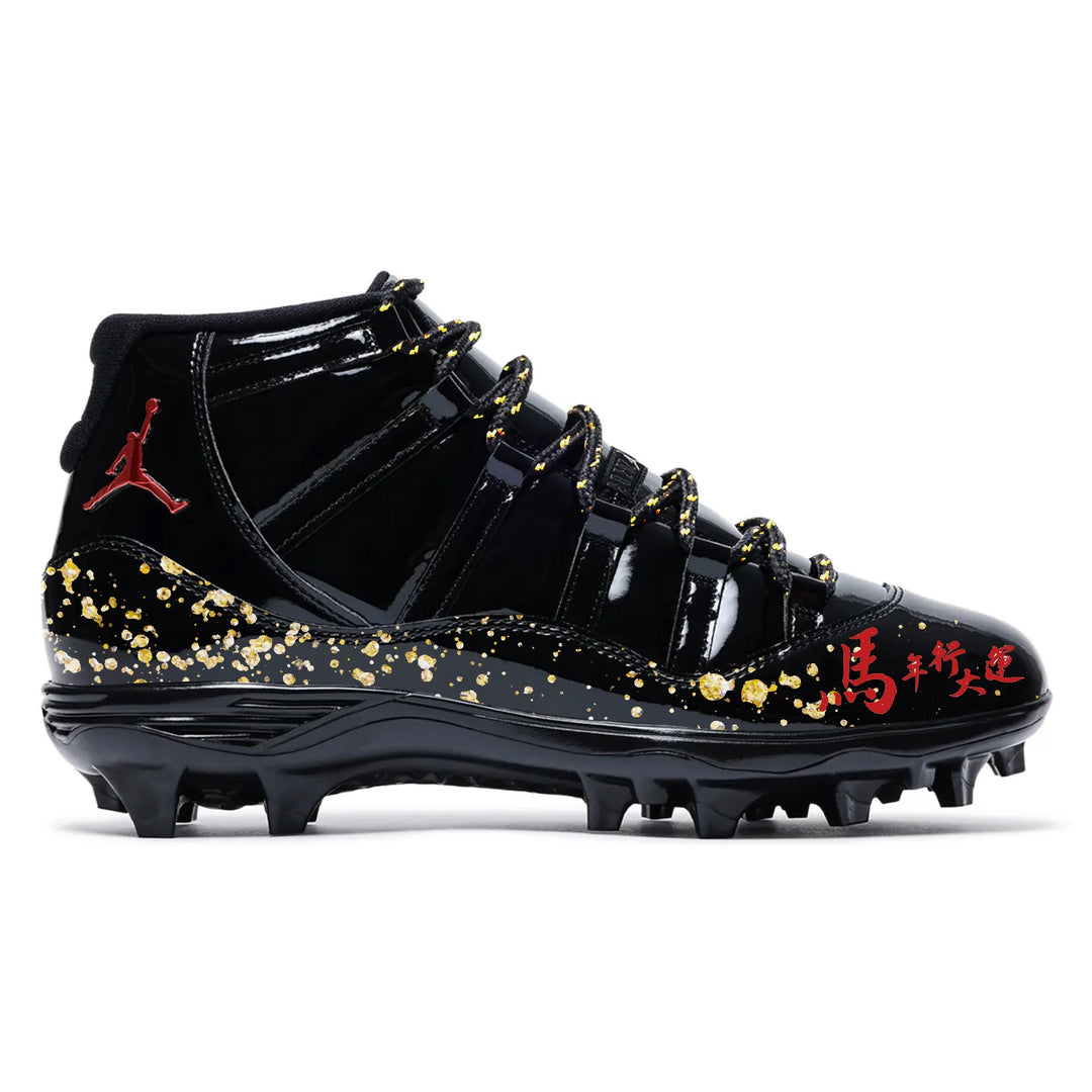 Custom black patent leather Jordan 11 TD football cleats with gold splatter and Chinese character detailing by Stadium Custom Kicks