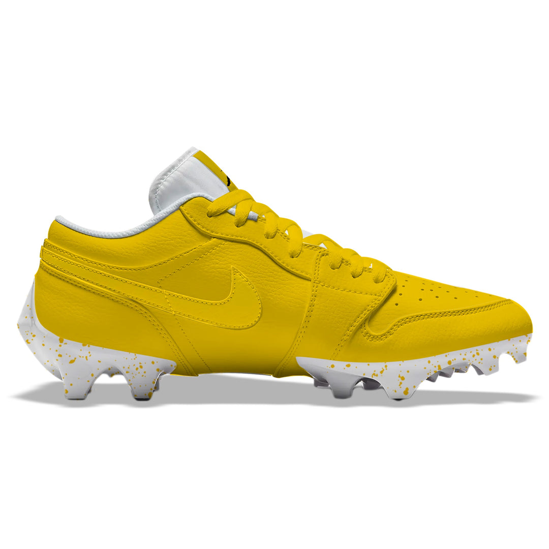 Yellow Color Rush Jordan 1 Vapor Edge Low football cleats in yellow with tonal Nike Swoosh and white splatter-patterned sole, side profile on a white background.