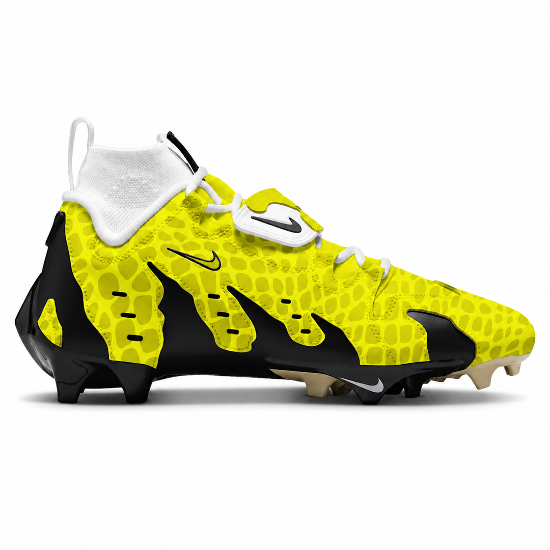A Nike football cleat in bright yellow and black with a textured alligator-pattern upper, white laces, a white ankle collar, and black Nike swooshes, shown from the side on a white background.
